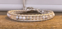 White stone on white leather